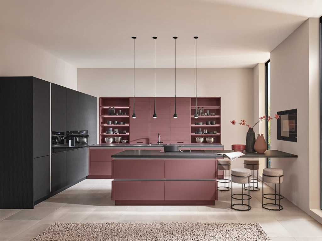 Modern handleless kitchen in burgundy with open shelving, pendant lighting and bar seating